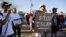 FILE - Demonstrators shout during a "Freedom of Speech Rally Round II" outside the Islamic Community Center in Phoenix, Arizona May 29, 2015.