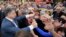 Ukrainian businessman, politician and presidential candidate Petro Poroshenko (L) meets his supporters during his election rally in the city of Kryvyi Rih May 17, 2014. 