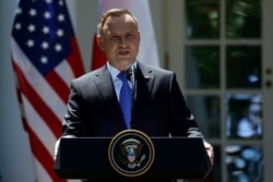 FILE - Polish President Andrzej Duda speaks during a news conference at the White House, June 12, 2019, in Washington.