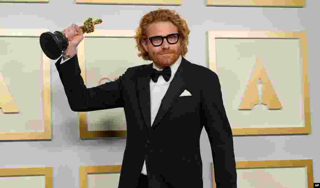 Erik Messerschmidt poses in the press room with the award for best cinematography for &quot;Mank&quot; at the Oscars on Sunday, April 25, 2021, at Union Station in Los Angeles. (AP Photo/Chris Pizzello, Pool)