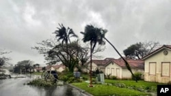 Cabang-cabang pohon yang tumbang mengotori kawasan Yona, Guam, setelah dihantam Topan Mawar, Kamis, 25 Mei 2023.(Chief Warrant Officer Adam Brown/U.S. Coast Guard via AP)