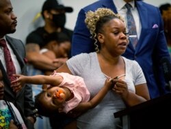 Tomika Miller, the widow of Rayshard Brooks, speaks at a news conference, June 15, 2020, in Atlanta.