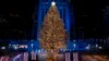 More than 50,000 lights on the 75-foot-tall Christmas Tree are illuminated at the annual Rockefeller Center Christmas Tree lighting ceremony, Dec. 2, 2020, in New York.