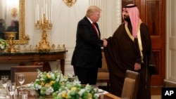 President Donald Trump shakes hands with Saudi Defense Minister and Deputy Crown Prince Mohammed bin Salman, Tuesday, March 14, 2017, in the State Dining Room of the White House in Washington.