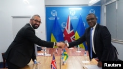 British Home Secretary James Cleverly and Rwandan Minister of Foreign Affairs Vincent Biruta hold a bilateral meeting after signing a new treaty, in Kigali, Rwanda, December 5, 2023. 