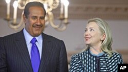 Secretary of State Hillary Rodham Clinton and Qatari Prime Minister Sheikh Hamad bin Jassim bin Jabor Al Thani at the State Department in Washington, Jan. 11, 2012.