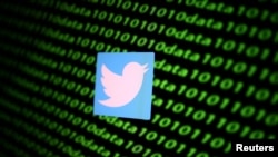 The Twitter logo and binary cyber codes are seen in this illustration taken Nov. 26, 2019. (Reuters/Dado Ruvic/Illustration/File Photo)