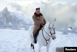 North Korean leader Kim Jong Un rides a horse during snowfall in Mount Paektu in this image released by North Korea's Korean Central News Agency (KCNA) on October 16, 2019. KCNA via REUTERS ATTENTION EDITORS - THIS IMAGE WAS PROVIDED BY A THIRD…