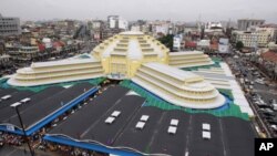 An elegant dome is seen atop French style Centeral Market "Phsar Thom Thmei" as it reopens Wednesday, May 25, 2011, in Phnom Penh, Cambodia, after seven years of renovations. Central Market is a large market constructed in 1937 in the shape of a dome wit