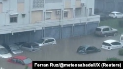 Vehicles are partially covered by floodwater as Cyclone Garance hits Saint-Denis, in the French island of Reunion, Feb. 28, 2025, in this screen grab obtained from a social media video.