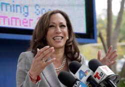 FILE - Then-California Attorney General Kamala Harris takes questions after voting in Los Angeles, June 7, 2016.