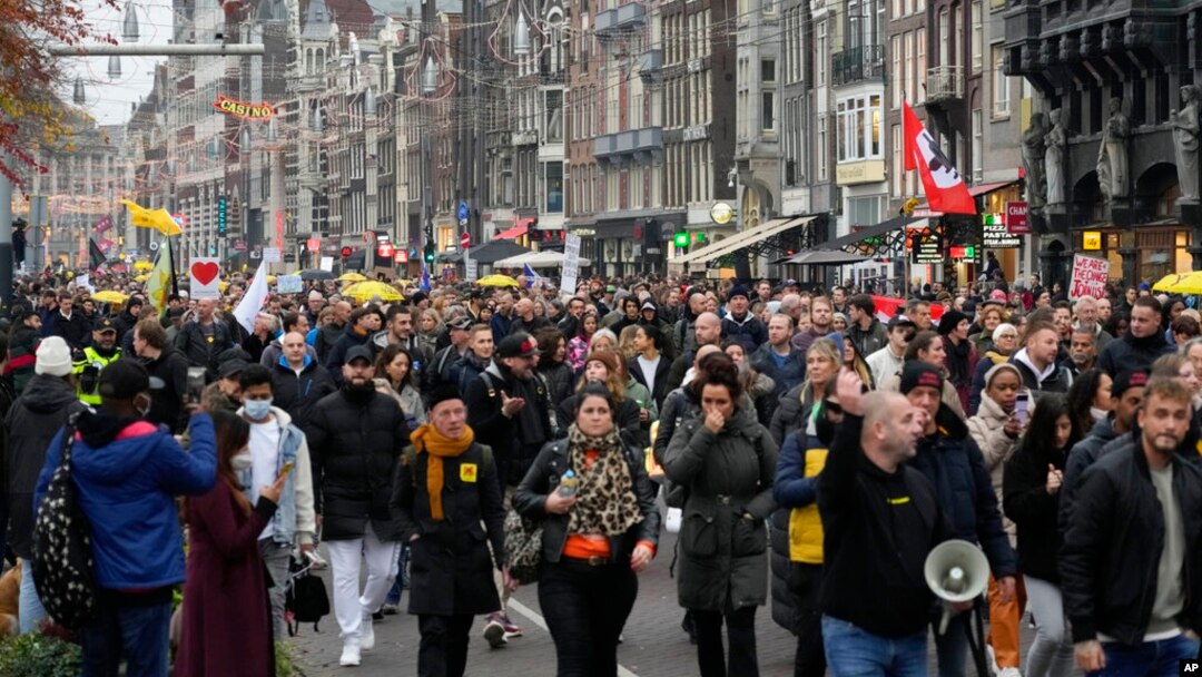 Thousands take part in a demonstration against COVID-19 restrictions in Amsterdam, Netherlands, Nov. 20, 2021. 