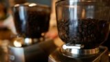 FILE—Coffee beans are seen in grinders at Vigilante Coffee, Wednesday, Sept. 1, 2021, in College Park, Md. 