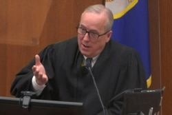 Hennepin County District Judge Peter Cahill speaks with legal teams in Minneapolis, Minnesota, April 12, 2021, in a still image from video.