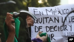 Abortion-rights demonstrators march during the "Day for Decriminalization of Abortion in Latin America and the Caribbean," in Mexico City, Sept. 28, 2020.