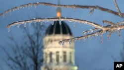 FILE - Ice hangs from trees in front of Jesse Hall, the campus administration building at the University of Missouri, in Columbia, Missouri, Nov. 30, 2006. 