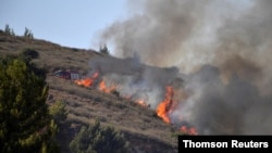 An Israeli fire truck is seen at a scene where fire broke out following a landing of a rocket that was fired at Israel from Lebanon, in Kiryat Shmona, Aug. 5, 2021.