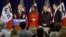 FILE - U.S. Republican presidential candidate Donald Trump speaks as, from left to right, his wife Melania, daughter Ivanka and Ivanka's husband Jared Kushner listen at a campaign rally on caucus day in Waterloo, Iowa, Feb. 1, 2016.