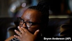 Michelle Branch wipes away tears on Monday May 17, 2021, talking about her brother, Craig Elazer, who died of a fentanyl overdose in St. Louis. (AP Photo/Brynn Anderson)