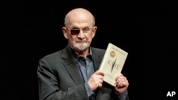 FILE - Salman Rushdie poses for a portrait to promote his book "Knife: Meditations After an Attempted Murder," at the Deutsches Theater in Berlin, Germany, May 16, 2024.