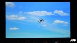 FILE - An Amazon delivery drone is displayed on a screen during a video presentation at an Amazon conference on robotics and artificial intelligence, in Las Vegas, Nevada, June 5, 2019. 