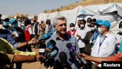 FILE - The United Nations High Commissioner for Refugees Filippo Grandi talks to the media during his visit to a refugee camp Sudan-Ethiopia border, Nov. 28, 2020.
