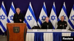 FILE —Israeli Prime Minister Benjamin Netanyahu, with Defense Minister Yoav Gallant and Cabinet minister Benny Gantz, at a press conference in the Kirya military base in Tel Aviv, Israel, 28 October 2023. 