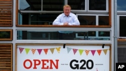 Pub owner Richard Deery awaits customers from the G-20 conference in Brisbane, Australia, Nov. 13, 2014. 