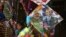 FILE - An Indian girl stands near a kite with portraits of India's Prime Minister Narendra Modi and U.S. President Barack Obama, for sale at a shop ahead of the Hindu festival Makar Sakranti, also known as kite festival, in Hyderabad, India, Jan. 12, 2015.