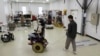 A Korea Institute of Machinery and Materials researcher controls a wheelchair with stiffness-variable "morphing" wheels in Daejeon, South Korea, Nov. 5, 2024.