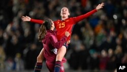 Spain's Eva Navarro, right, celebrates with a teammate after defeating Sweden in the Women's World Cup semifinal soccer match at Eden Park in Auckland, New Zealand, Tuesday, Aug. 15, 2023.