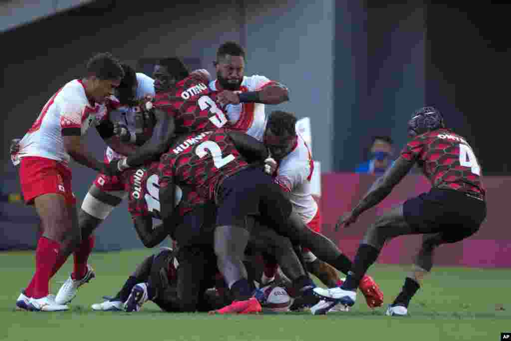 Japan and Kenya players vie for the ball in their men&#39;s rugby sevens match at the 2020 Summer Olympics, Tuesday, July 27, 2021 in Tokyo, Japan. (AP Photo/Shuji Kajiyama)