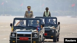 FILE - Myanmar's junta chief Senior General Min Aung Hlaing, who ousted the elected government in a coup on February 1, presides an army parade on Armed Forces Day in Naypyitaw, Myanmar, March 27, 2021. (Reuters)