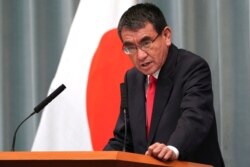 FILE - Defense Minister Taro Kono speaks during a press conference at the prime minister's official residence in Tokyo, Sept. 11, 2019.