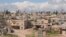 A general view shows Khan al-Assal area near the northern city of Aleppo, near the site where forces loyal to Syria's President Bashar al-Assad say a chemical weapons attack occurred, March 23, 2013.