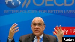 Angel Gurria, secretary-general of the Organisation for Economic Co-operation and Development (OECD), gestures during a news conference, part of the G20 finance ministers and central bank governors' meeting, in Moscow, Russia, July 19, 2013. 