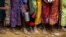 FILE _ Bare feet of Rohingya refugee children are pictured as they stand in a queue while waiting to receive food outside the distribution center in Palongkhali makeshift refugee camp in Cox's Bazar, Bangladesh, Nov. 7, 2017. 