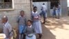 Pupils play during their lunch break at Mariakani Primary School in Nairobi, Kenya Monday, July 27, 2015. Mr. Obama announced during his visit to Kenya Sunday that Kenya would be part of PEPFAR's DREAMS project to protect adolescent girls from HIV. (AP Photo/Khalil Senosi)