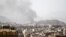 Smoke rises after an airstrike in Sanaa, Yemen, March 22, 2018.