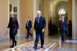 Senate Majority Leader Mitch McConnell of Ky. walks to the Senate chamber on Capitol Hill in Washington, March 24, 2020.