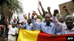 Malian people take part in a demonstration in front of the French Ambassy in Bamako on May 19, 2014, to denounce the occupation by rebels of Kidal, 1,500 kilometres (900 miles) northeast of the capital Bamako, and accuse France of complicity with armed gr