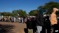 Residents await their turns to cast their votes during an election to decide if it keeps faith with one of Africa's longest-ruling parties, in Gaborone, Botswana, Oct. 30, 2024.