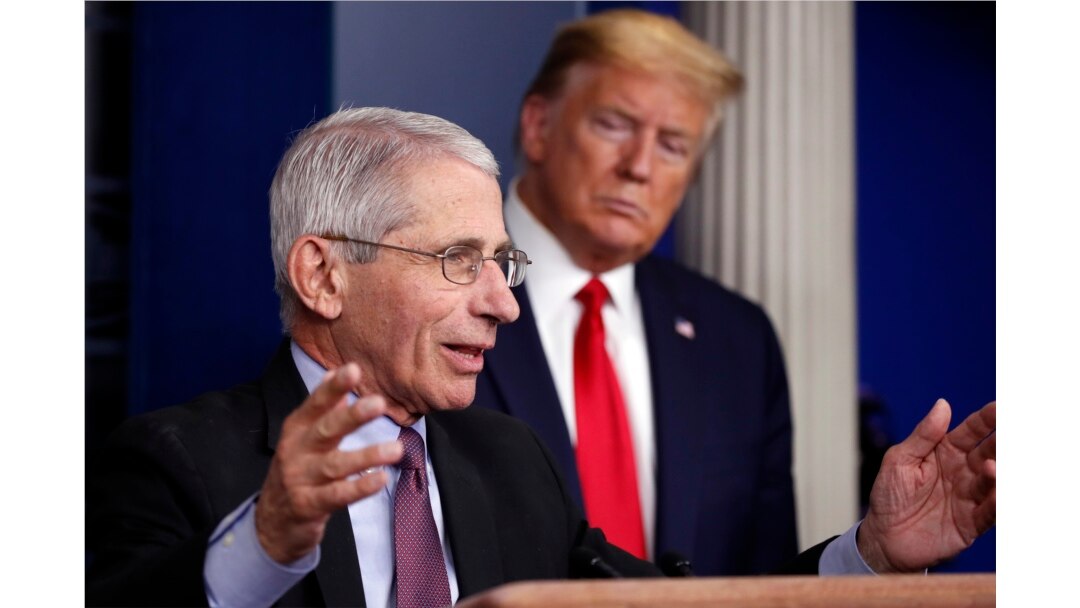 FILE - President Donald Trump watches as Dr. Anthony Fauci, director of the National Institute of Allergy and Infectious Diseases, speaks about the coronavirus in the James Brady Press Briefing Room of the White House in Washington, April 22, 2020.