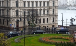 A convoy transporting Russian President Vladimir Putin arrives in central Budapest, Hungary, Oct. 30, 2019.
