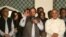Former Prime Minister and leader of the Pakistan Muslim League-N party Nawaz Sharif, center, addresses his supporters at a party office in Lahore, May 11, 2013.