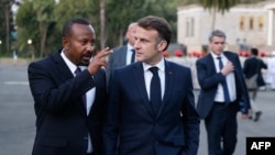 Ethiopia's Prime Minister Abiy Ahmed, left, speaks with France's President Emmanuel Macron during a visit at the newly renovated Ethiopia&#146;s Historic National Palace in Addis Ababa on Dec. 21, 2024.