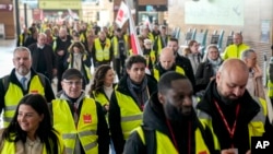 Participants of a strike march at the Berlin-Brandenburg airport, March 10, 2025.