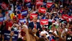 President Donald Trump reacts to the crowd after speaking during his re-election kickoff rally at the Amway Center, Tuesday, June 18, 2019, in Orlando, fla. 