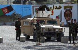 Afghan special forces stand guard near the site of a suicide bomber attack on the outskirts of Kabul, Afghanistan, April 29, 2020.