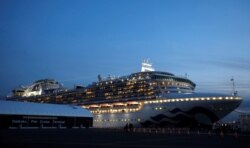The cruise ship Diamond Princess, where more than 60 people have tested positive for coronavirus so far, is seen at Daikoku Pier Cruise Terminal in Yokohama, south of Tokyo, Feb. 7, 2020.